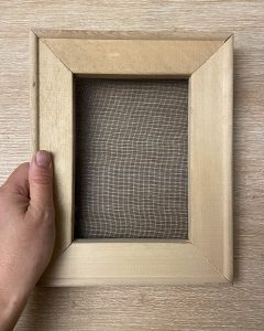 A window screen stapled to a canvas frame makes excellent paper